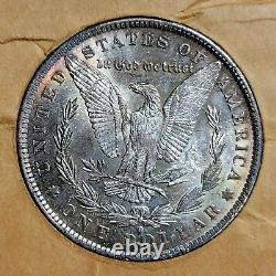 1884O TIDY HOUSE CARD Morgan Silver Dollar With REPUNCHED MINT, GEM BU With TONE