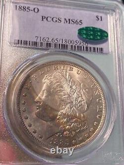 1885-O $1 PCGS/CAC MS65 Morgan Rainbow Crescent Toned GEM CAC Holder Chipped