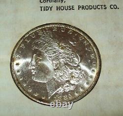 1885-O Morgan Silver Dollar in Tidy House Card Choice/GEM BU? Nice