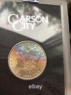 1885 cc Morgan, silver dollar GSA MS 64. NGC Rainbow toned GEM