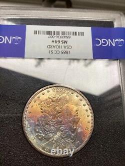 1885 cc Morgan, silver dollar GSA MS 64. NGC Rainbow toned GEM