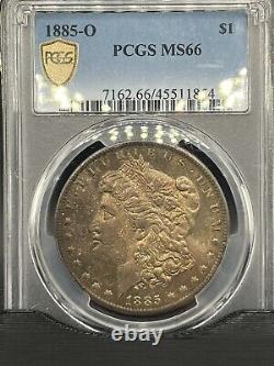 #690 1885 O Morgan Silver Dollar PCGS MS66. Flawless Monster Toned Gem